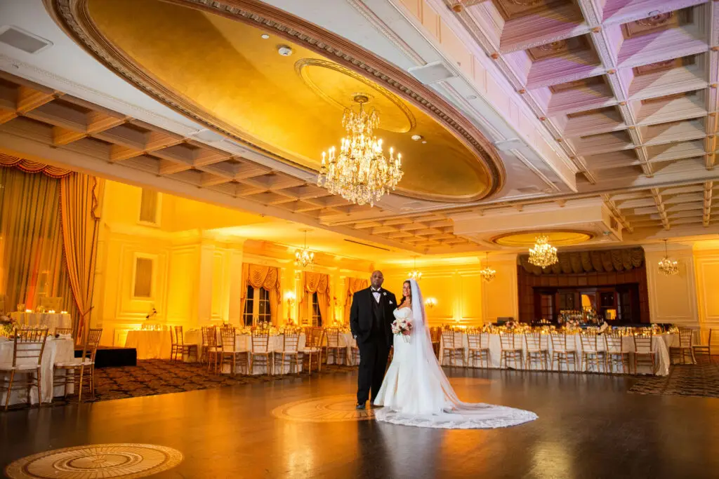 Newlyweds captured in the luxurious ballroom of The Inn at New Hyde Park