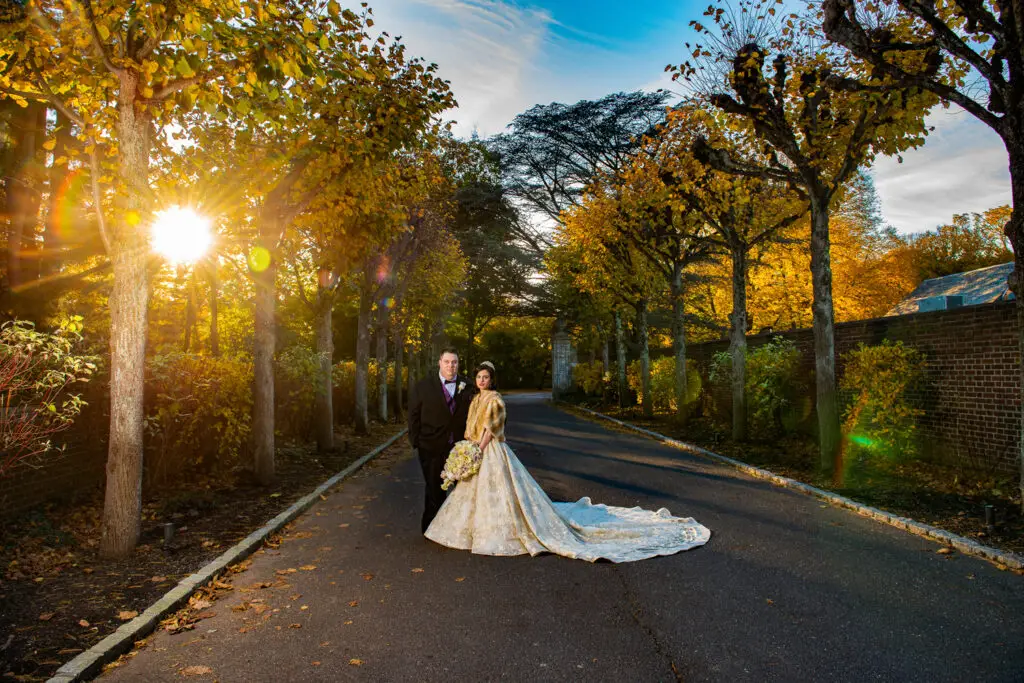 Bride and groom at sunset during fall wedding at NYIT de Seversky Mansion​