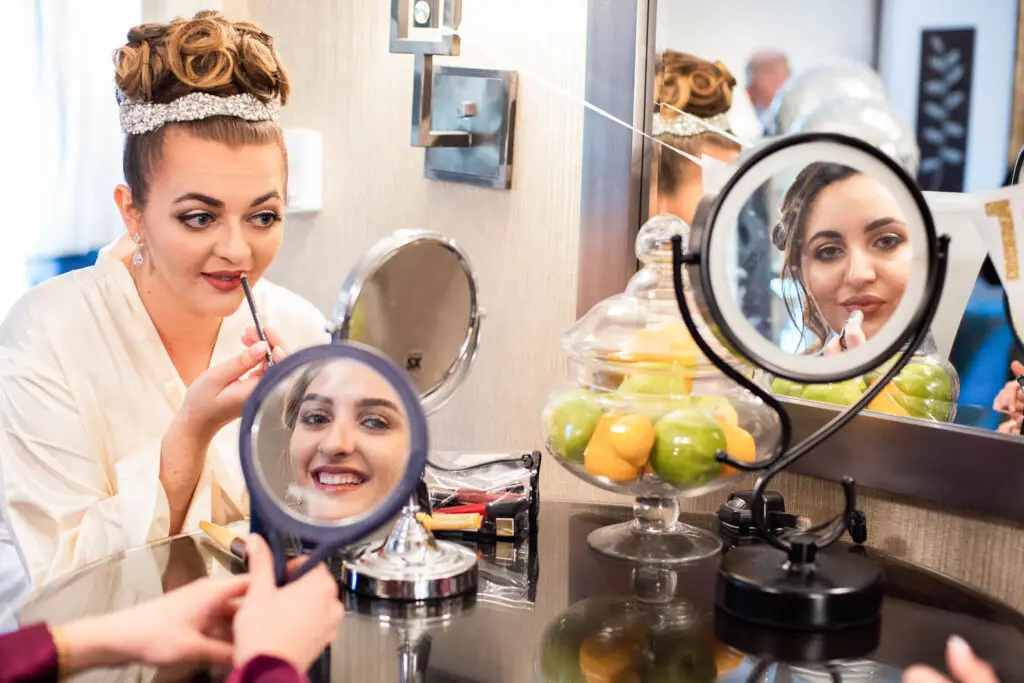Wedding day makeup finishing touches for the bride