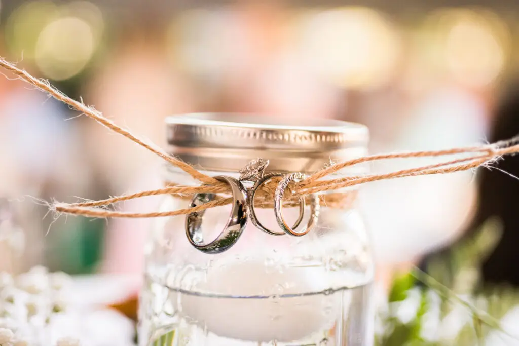 Elegant wedding bands tied together on a thin string