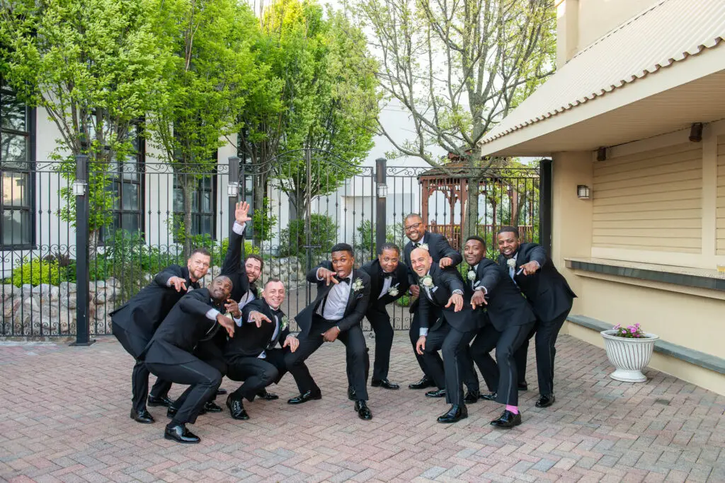 Fun and candid groomsmen photo session at wedding