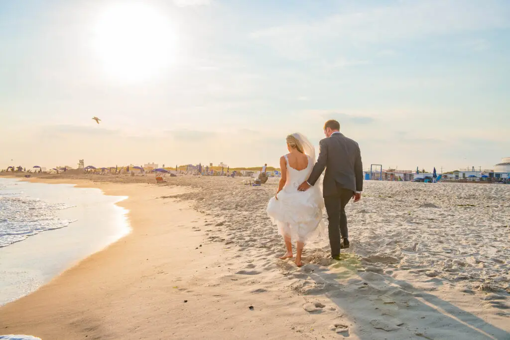 Wedding couple walking into the golden sunset at Sands Atlantic