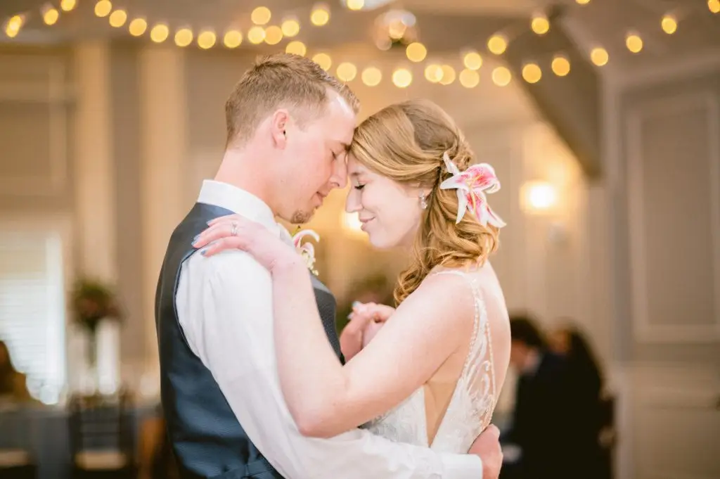 Bride and groom with eyes closed sharing an intimate first dance