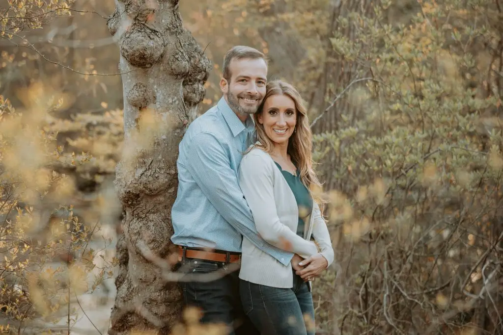 Romantic engagement photo with earthy brown hues at Hempstead Lake Park, Rockville Centre, NY