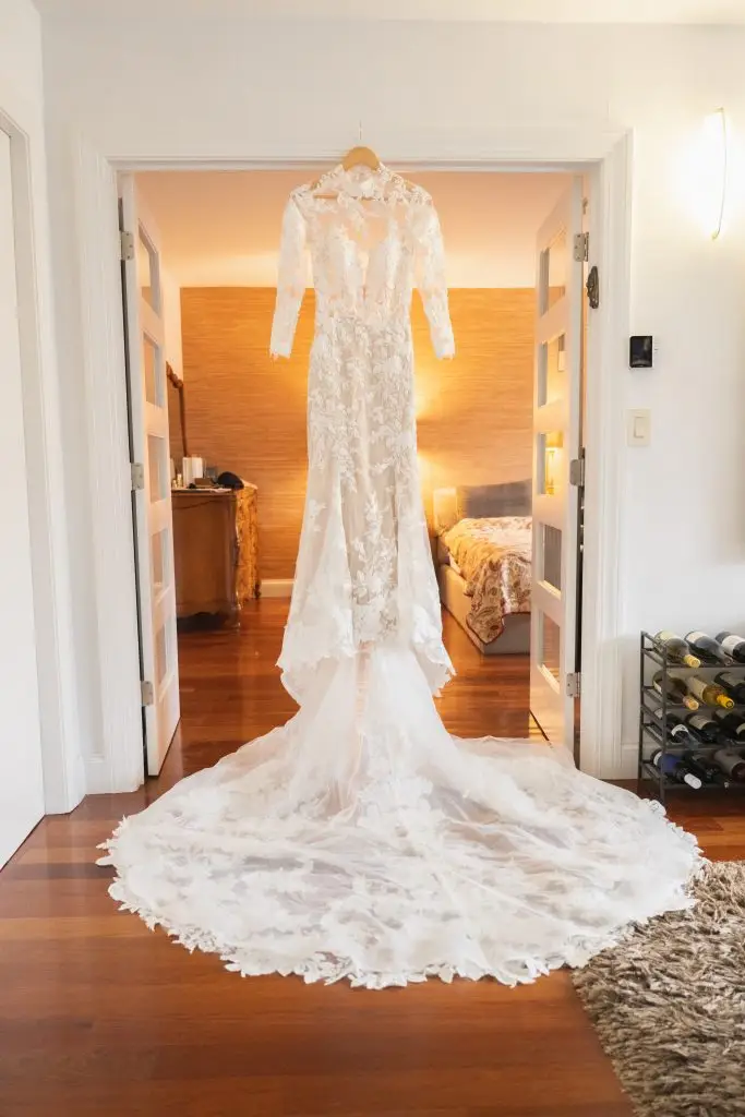 Luxury bridal gown hanging in a stylish Manhattan loft