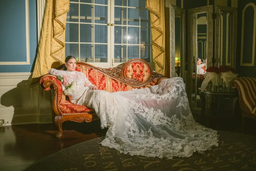 Elegant bride on antique Victorian sofa at 48th Wall Street