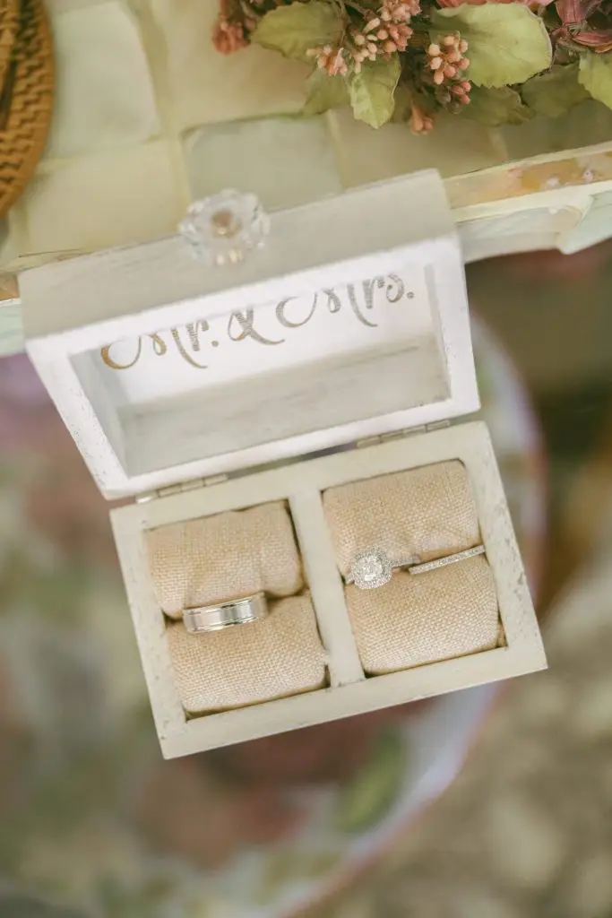 Timeless wedding rings in an antique-style white ring box