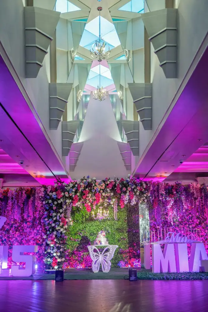 Luxurious quinceañera ballroom setup with elegant decor
