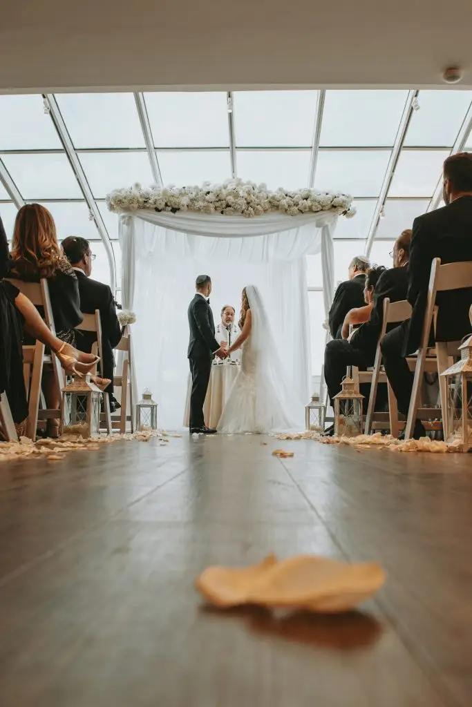 Bride and groom exchanging vows at The Piermont with warm brown tone editing​