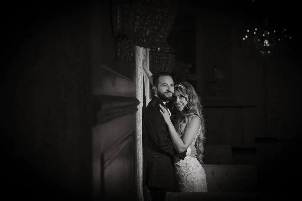Bride and groom posing elegantly at Floral Terrace, Floral Park, NY​
