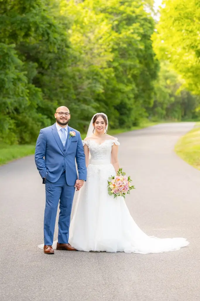 Bride and groom holding hands in a timeless wedding portrait
