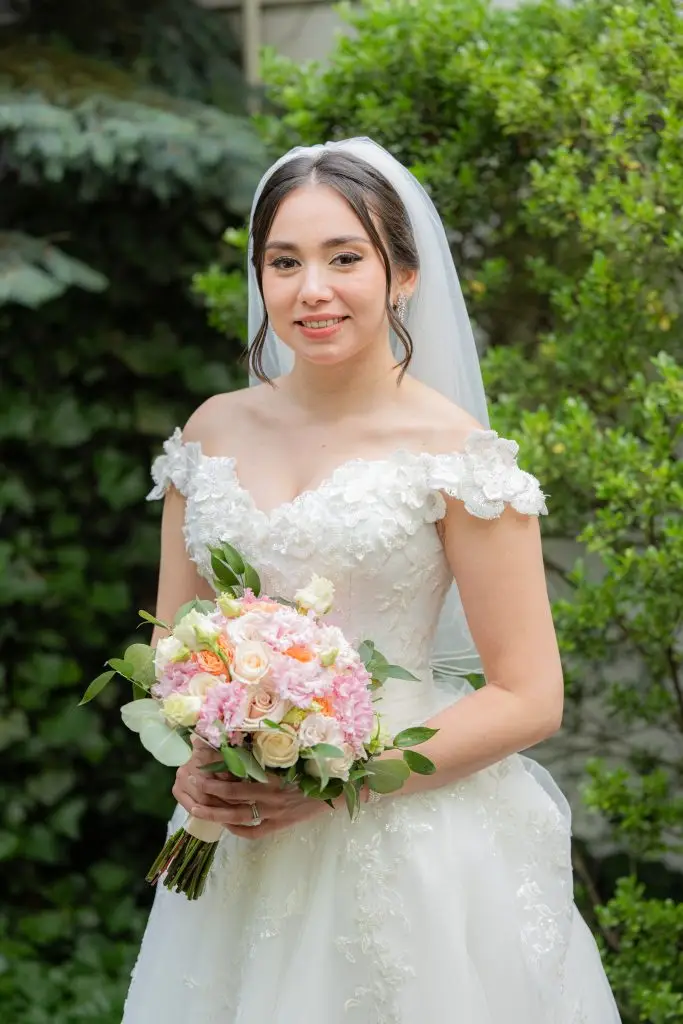 Bride posing in Rare650's lush garden area, Syosset, NY