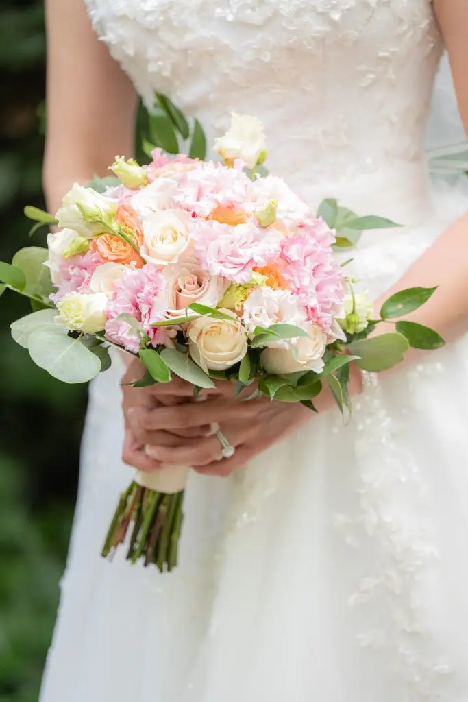 Bride showcasing bouquet at Rare 650, Syosset​