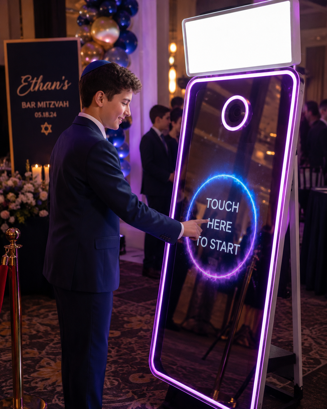 Bar mitzvah guest of honor starting a session on the mirror photo booth at a Long Island celebration